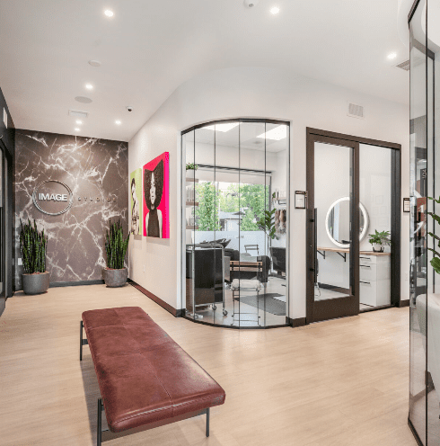 Modern beauty salon interior with reception area.